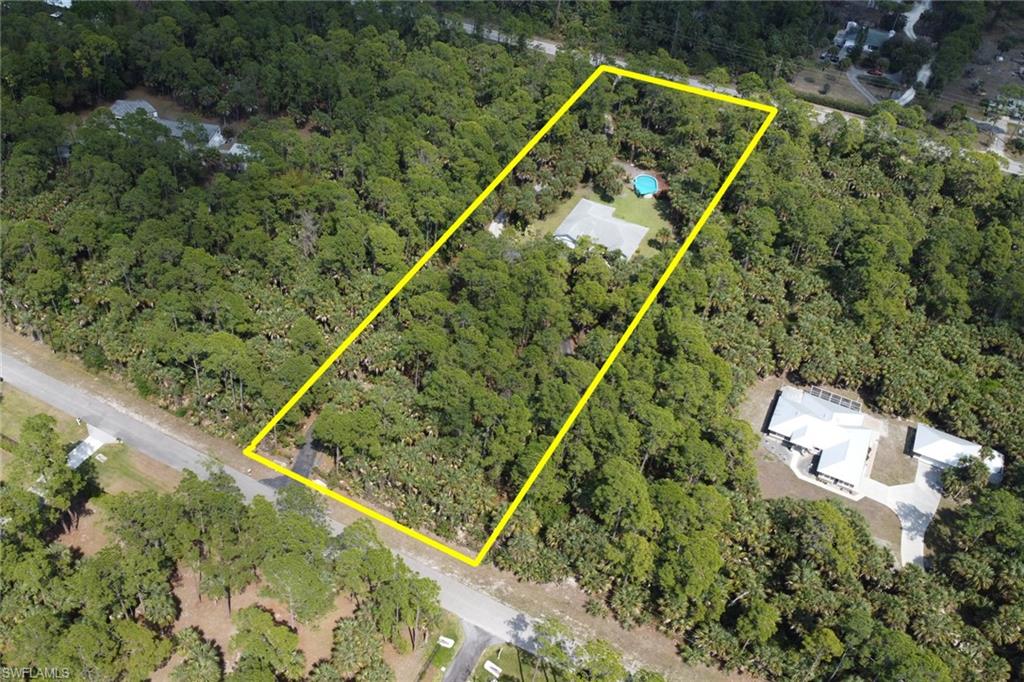760 1st Street Northwest Naples, FL 34120 - Photo 33 of 36 a view of a tennis court