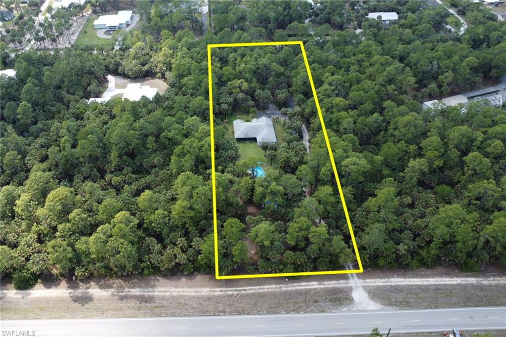 760 1st Street Northwest Naples, FL 34120 - Photo 35 of 36 a view of a yard