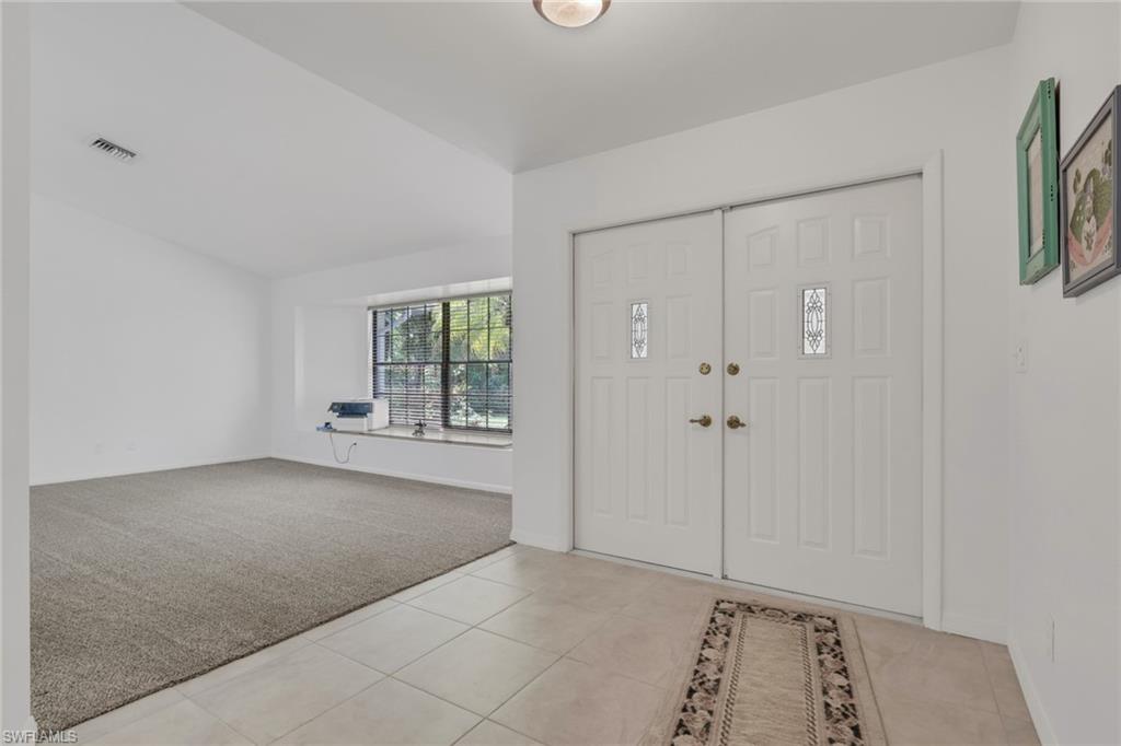 760 1st Street Northwest Naples, FL 34120 - Photo 6 of 36 a view of an empty room with window and closet
