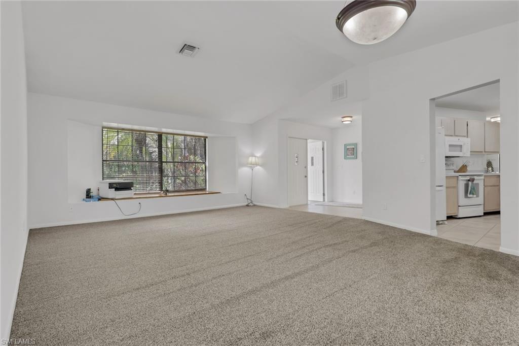 760 1st Street Northwest Naples, FL 34120 - Photo 8 of 36 a view of an empty room with a window and bathroom