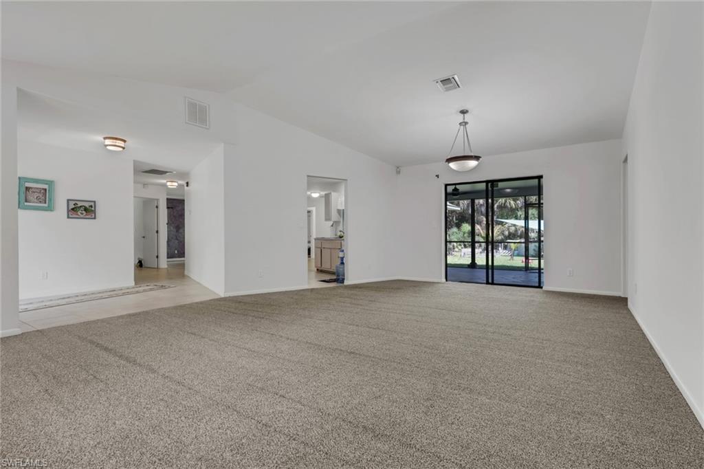 760 1st Street Northwest Naples, FL 34120 - Photo 9 of 36 a view of an empty room with a window