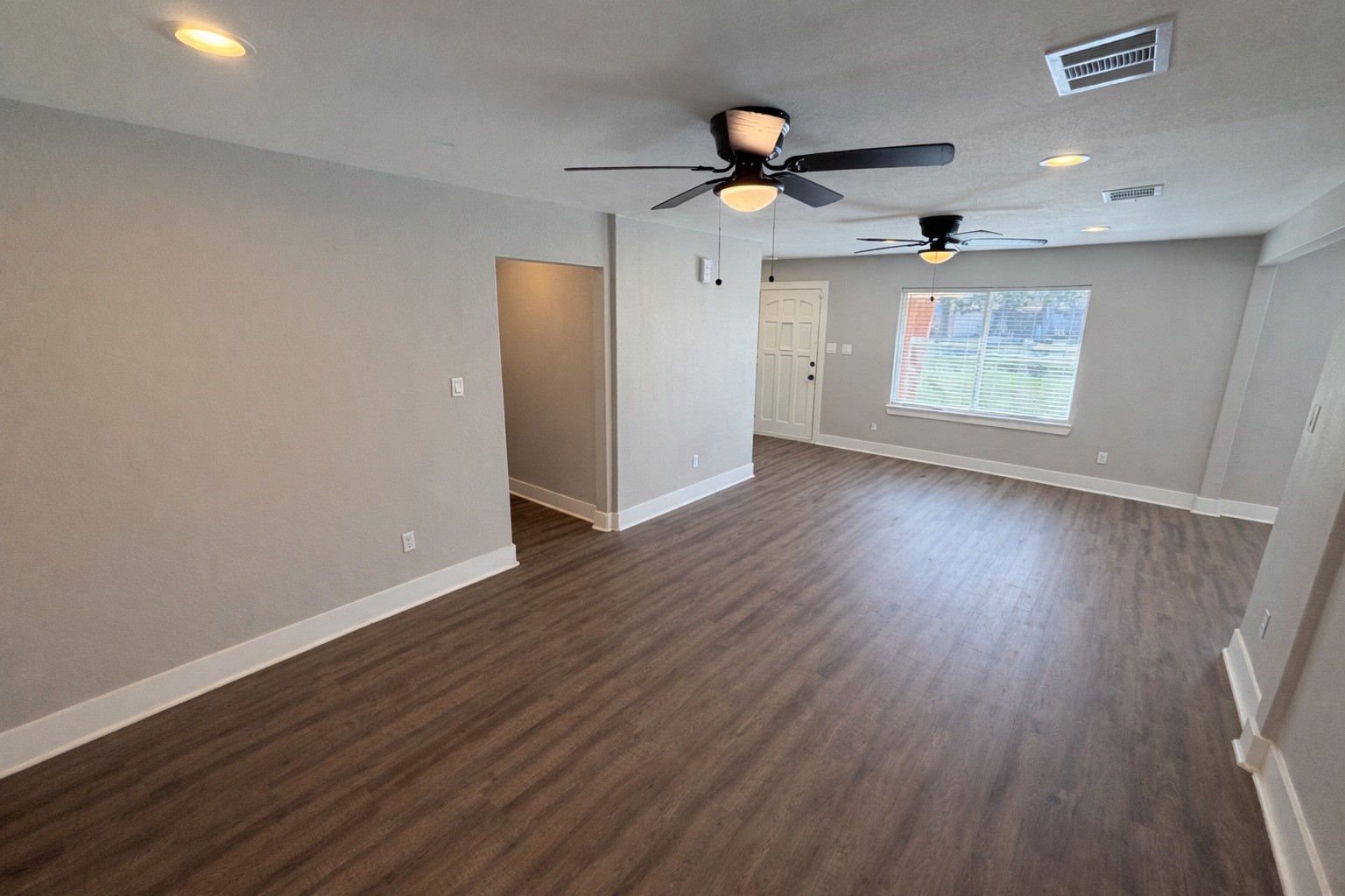 5105 Oak Avenue Pasadena, TX 77503 - Photo 3 of 15 wooden floor in an empty room with a window
