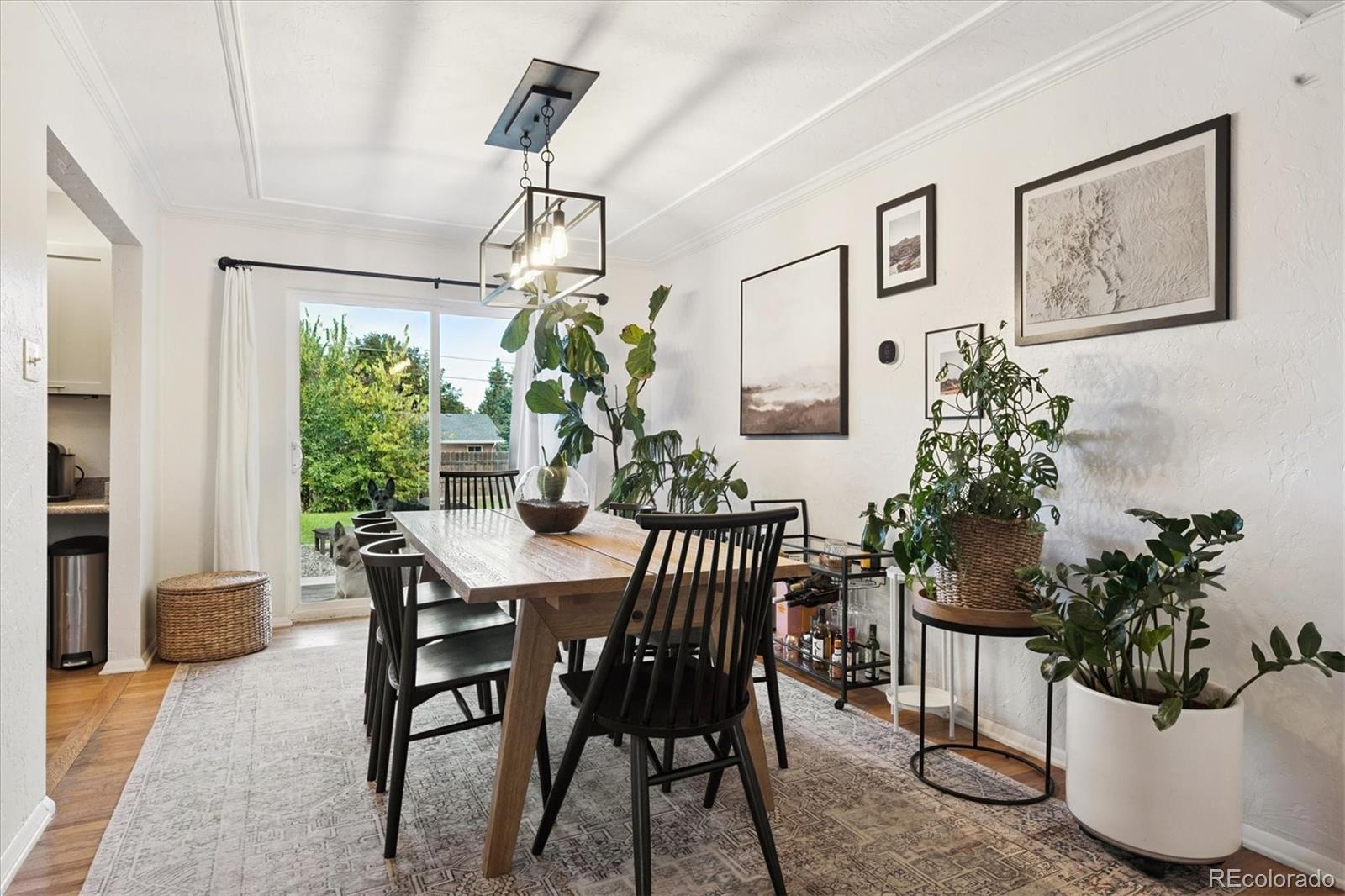 3675 South Hibiscus Way Denver, CO 80237 - Photo 11 of 50 a view of a dining room with furniture window and flowerpot