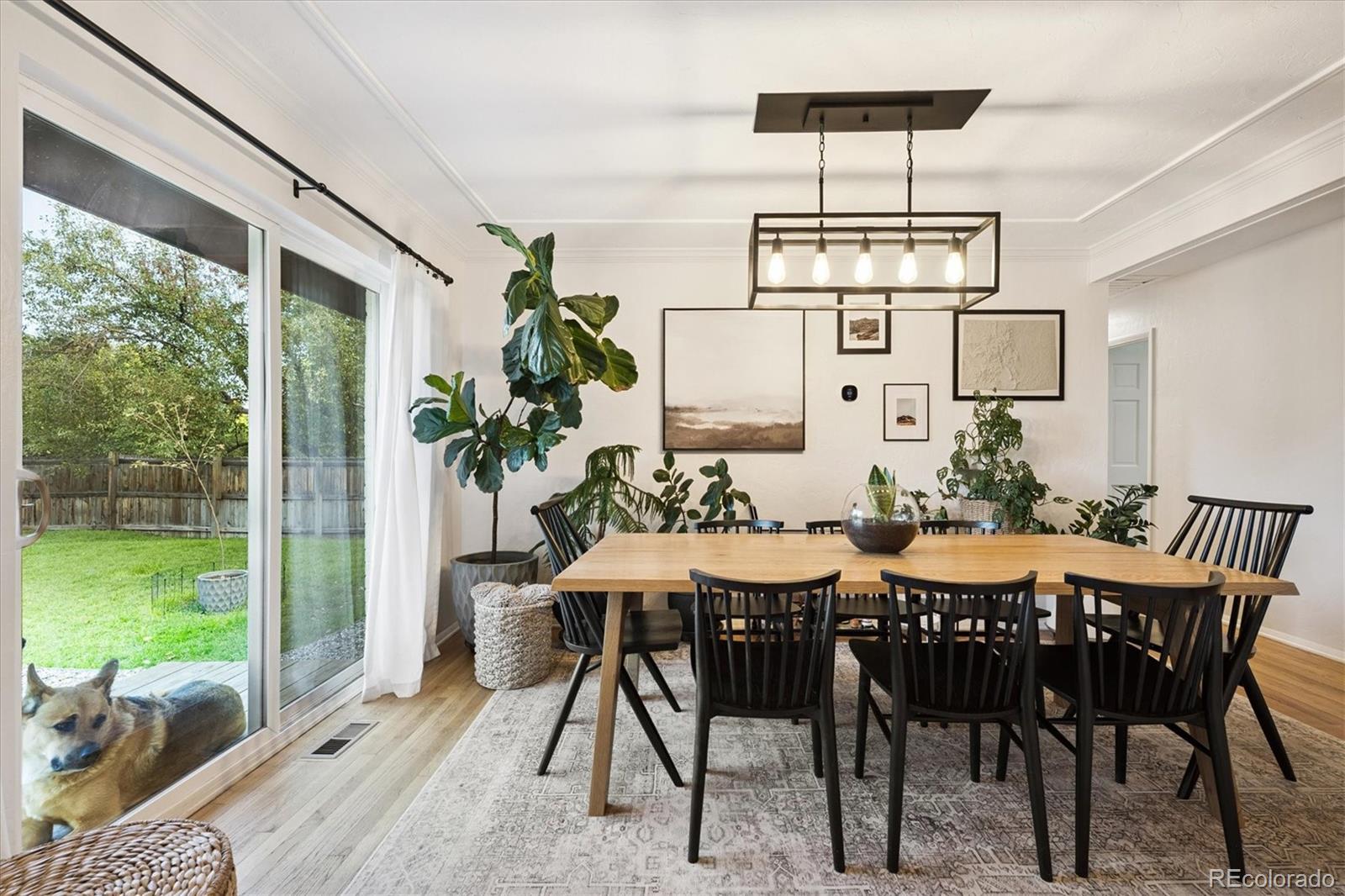 3675 South Hibiscus Way Denver, CO 80237 - Photo 12 of 50 a view of a dining room with furniture window and outside view