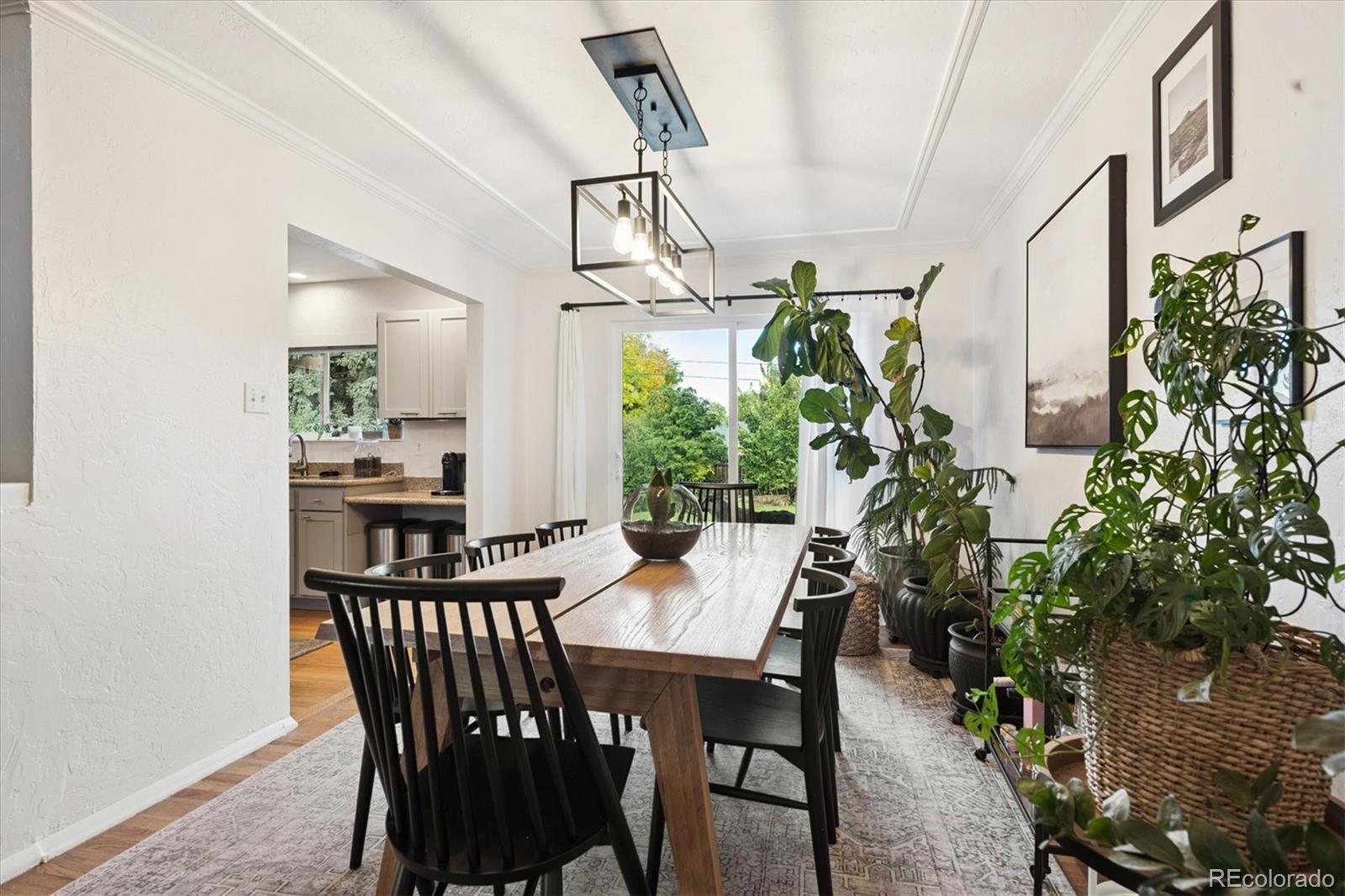 3675 South Hibiscus Way Denver, CO 80237 - Photo 13 of 50 a view of a dining room with furniture window and wooden floor