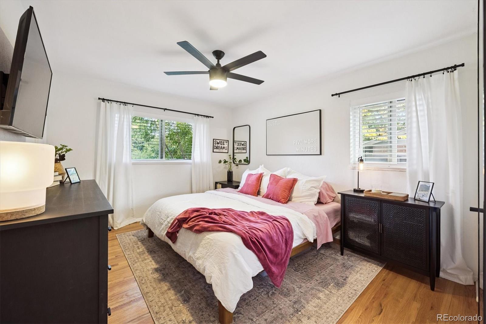 3675 South Hibiscus Way Denver, CO 80237 - Photo 24 of 50 a bedroom with a bed and a window