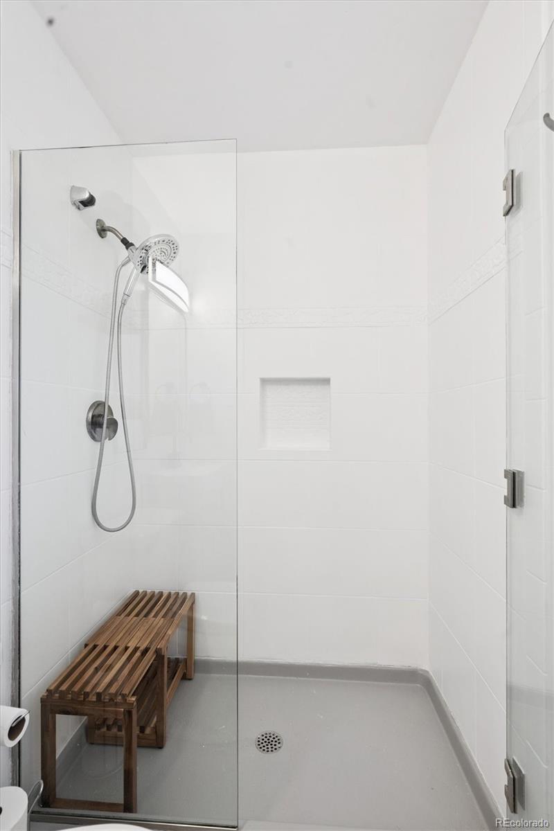 3675 South Hibiscus Way Denver, CO 80237 - Photo 27 of 50 a bathroom with a shower