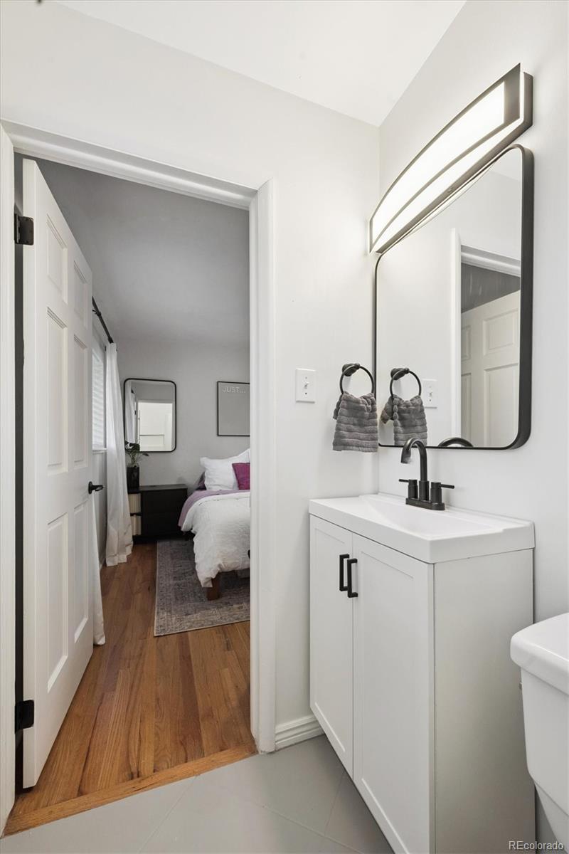 3675 South Hibiscus Way Denver, CO 80237 - Photo 28 of 50 a en suite bathroom with a toilet sink and mirror