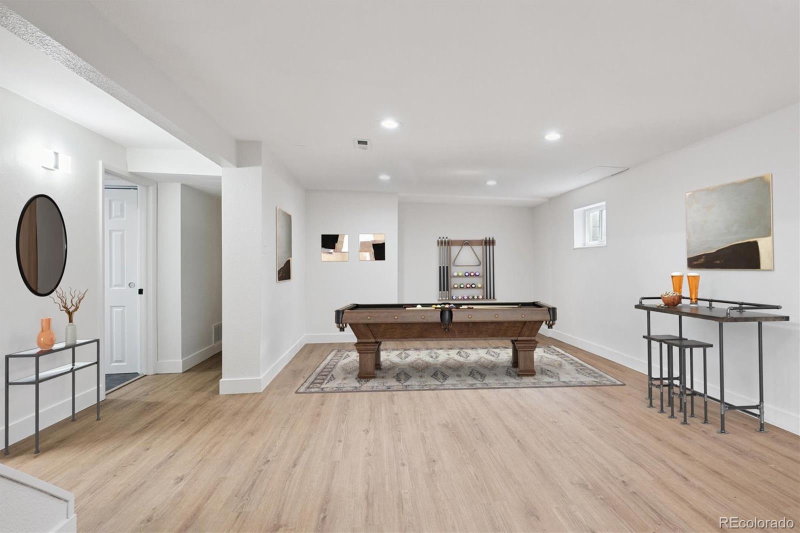 3675 South Hibiscus Way Denver, CO 80237 - Photo 30 of 50 a living room with furniture a rug and a painting