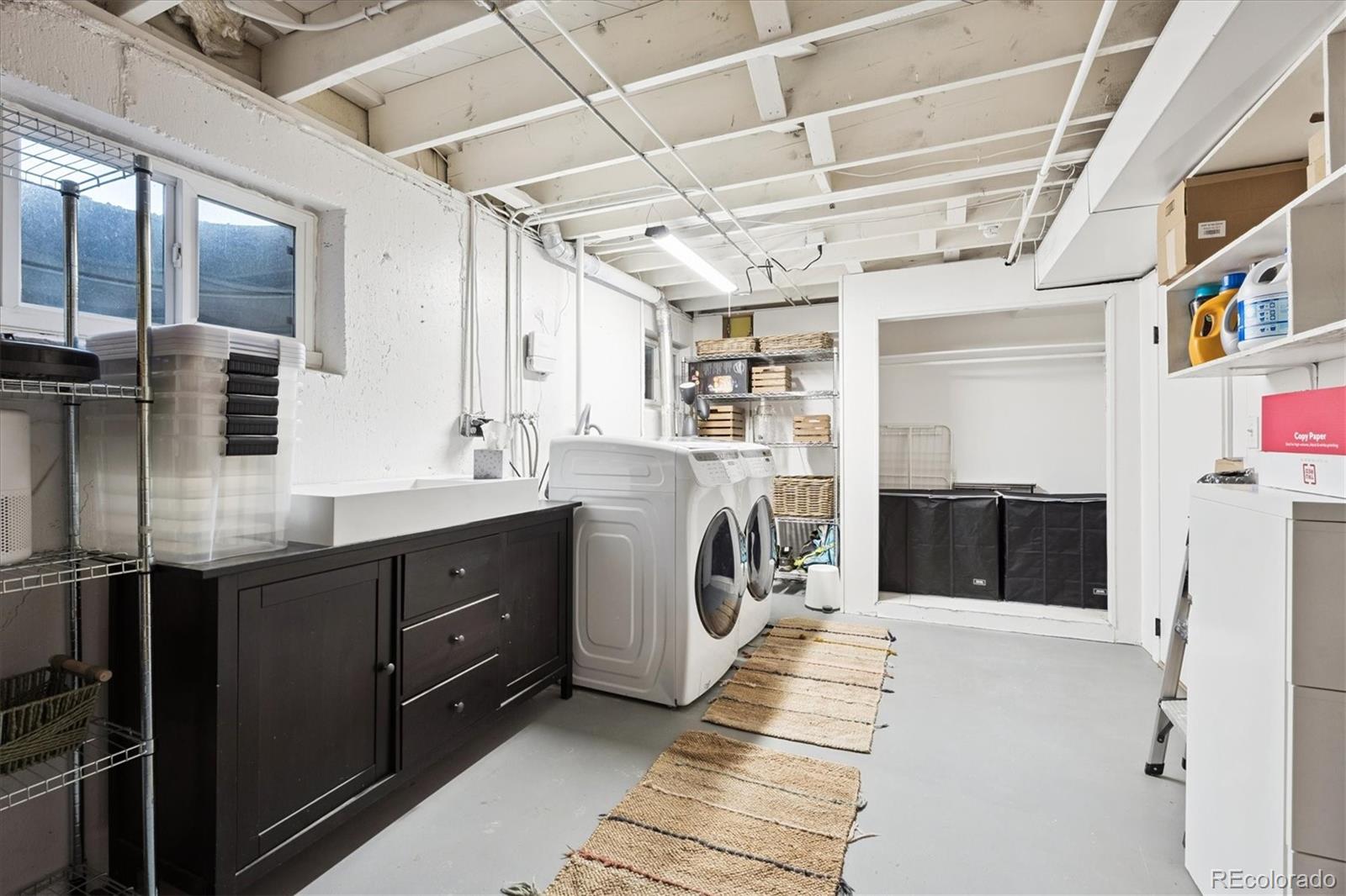 3675 South Hibiscus Way Denver, CO 80237 - Photo 36 of 50 a kitchen with stainless steel appliances a sink and a refrigerator