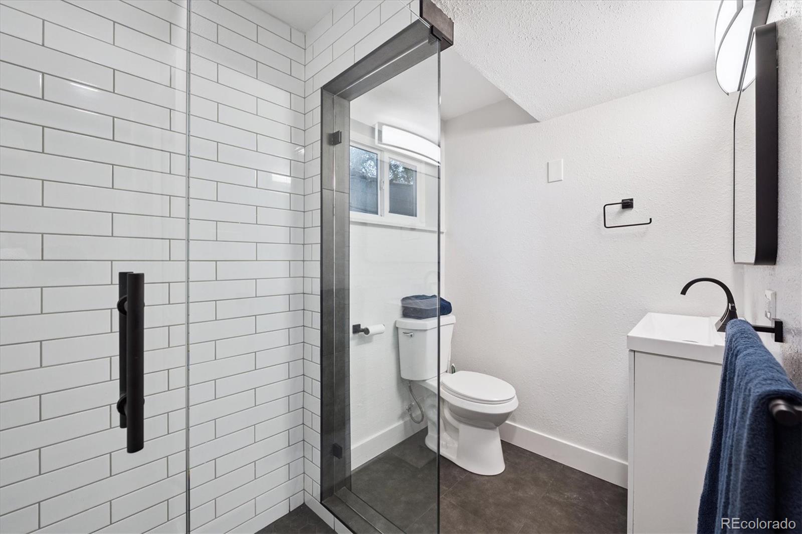 3675 South Hibiscus Way Denver, CO 80237 - Photo 40 of 50 a bathroom with a toilet and a shower