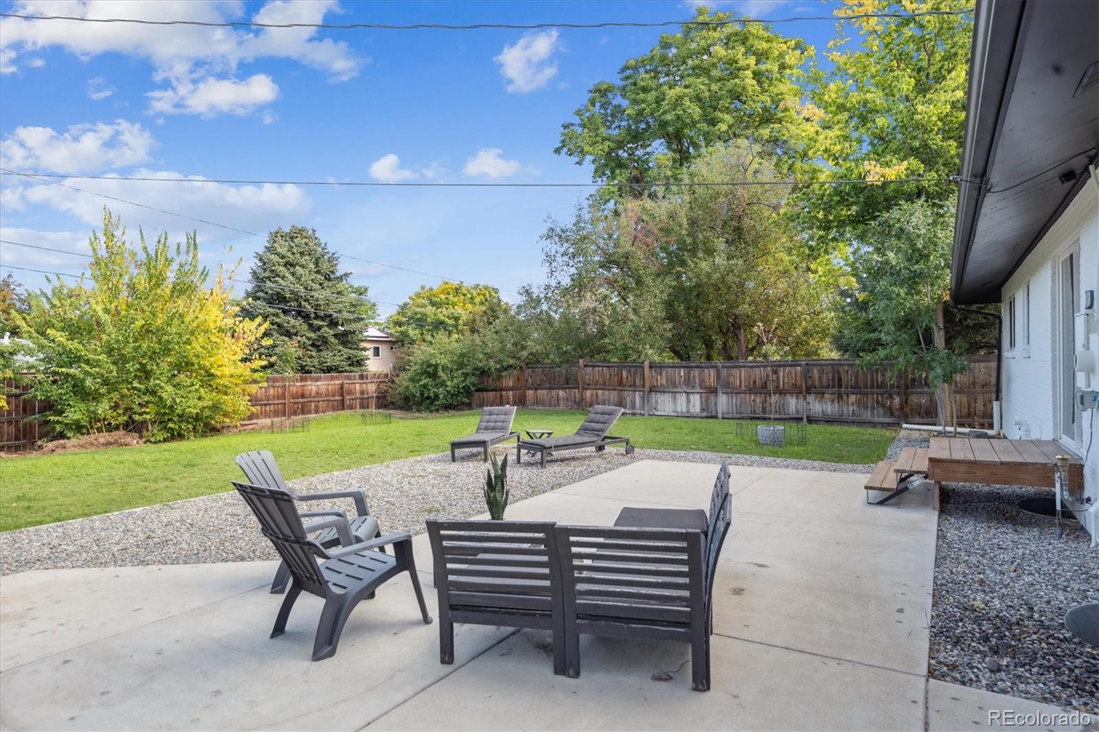 3675 South Hibiscus Way Denver, CO 80237 - Photo 44 of 50 a view of yard with seating area and green space