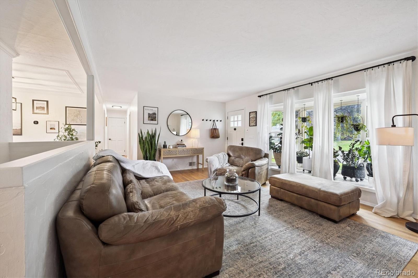 3675 South Hibiscus Way Denver, CO 80237 - Photo 9 of 50 a living room with furniture and a large window