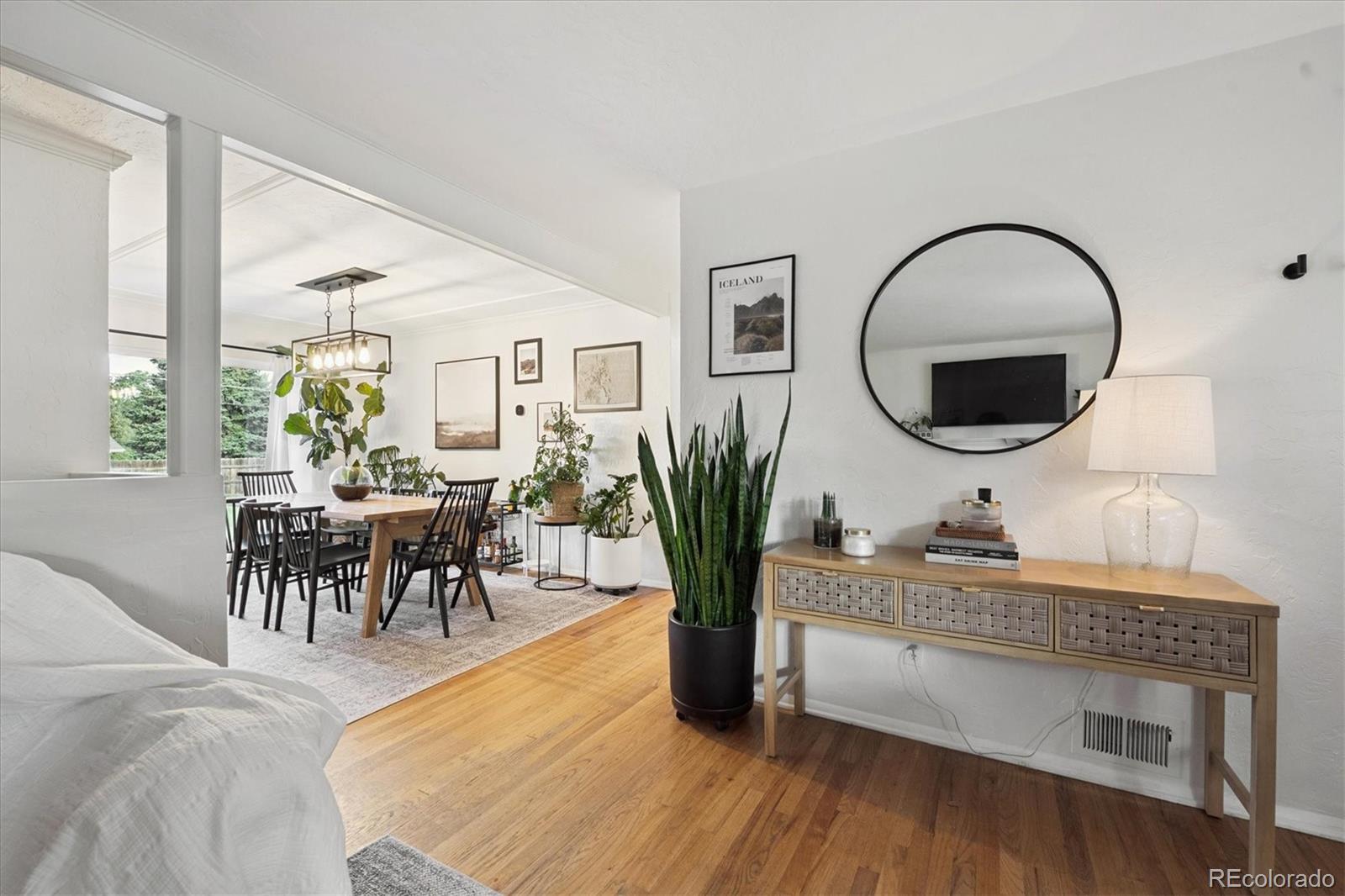 3675 South Hibiscus Way Denver, CO 80237 - Photo 10 of 50 a living room with furniture potted plant and a mirror