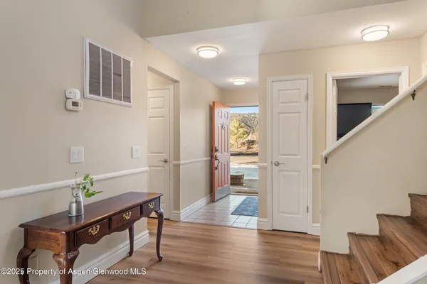 a view of entryway with wooden floor