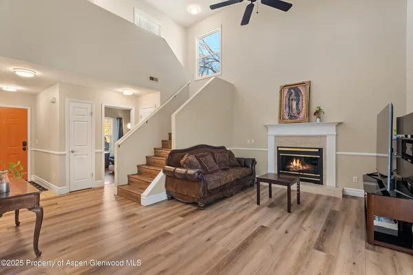 a living room with furniture and a fireplace