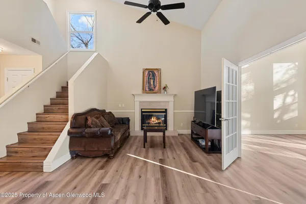 a living room with furniture fireplace and flat screen tv