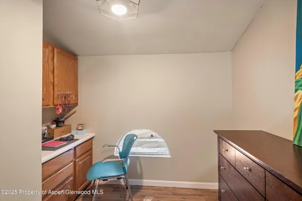 a workspace with furniture and wooden floor