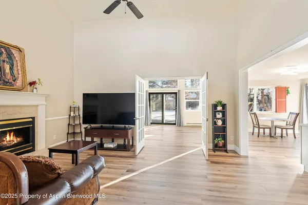 a living room with furniture and a flat screen tv