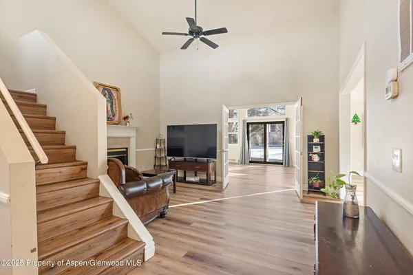 a view of a livingroom with furniture and a flat screen tv