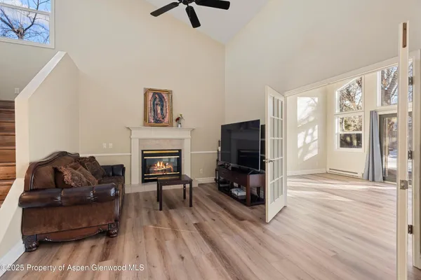 a living room with furniture and a fireplace