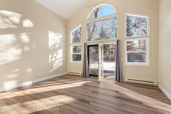 a view of an empty room with a window