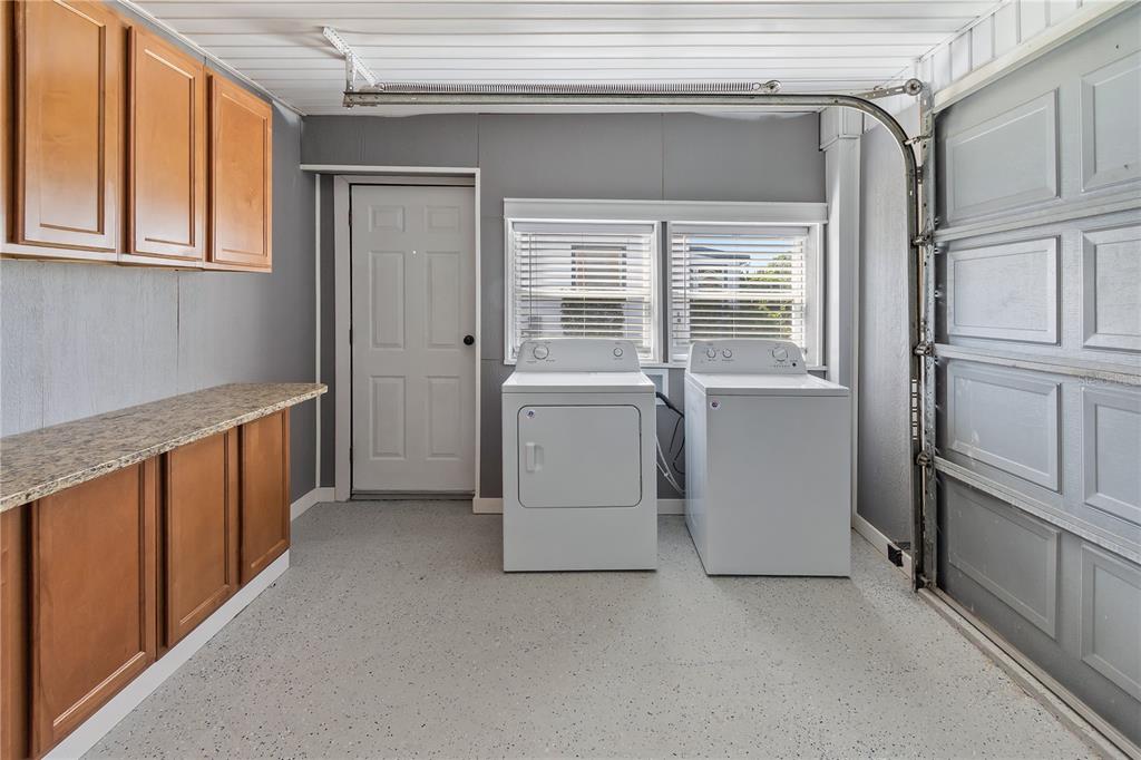 319 Thomas Avenue Frostproof, FL 33843 - Photo 26 of 47 a view of a kitchen with fridge and wooden floor