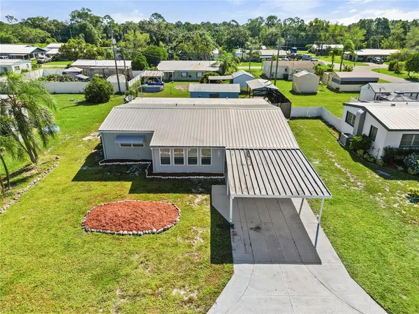 an aerial view of a house with garden space sitting space