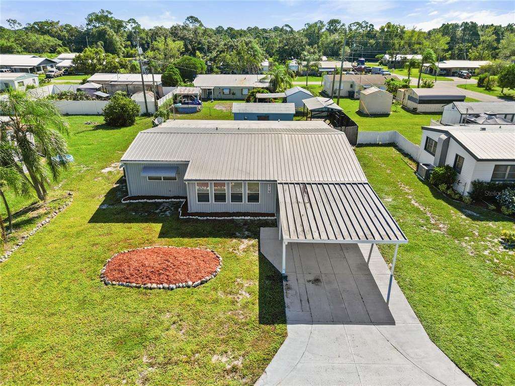 319 Thomas Avenue Frostproof, FL 33843 - Photo 28 of 47 an aerial view of a house with garden space sitting space