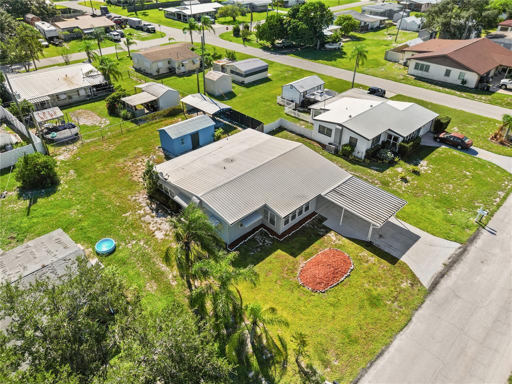 319 Thomas Avenue Frostproof, FL 33843 - Photo 32 of 47 an aerial view of a house with swimming pool yard and outdoor seating