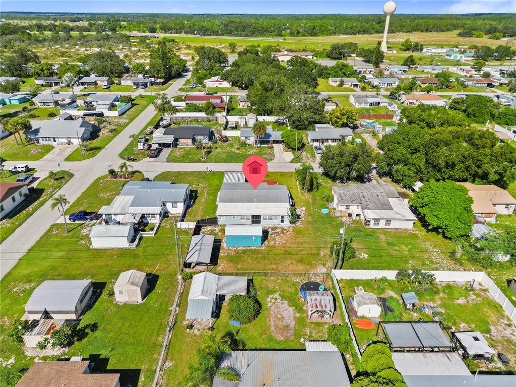 319 Thomas Avenue Frostproof, FL 33843 - Photo 33 of 47 an aerial view of residential houses with outdoor space and parking