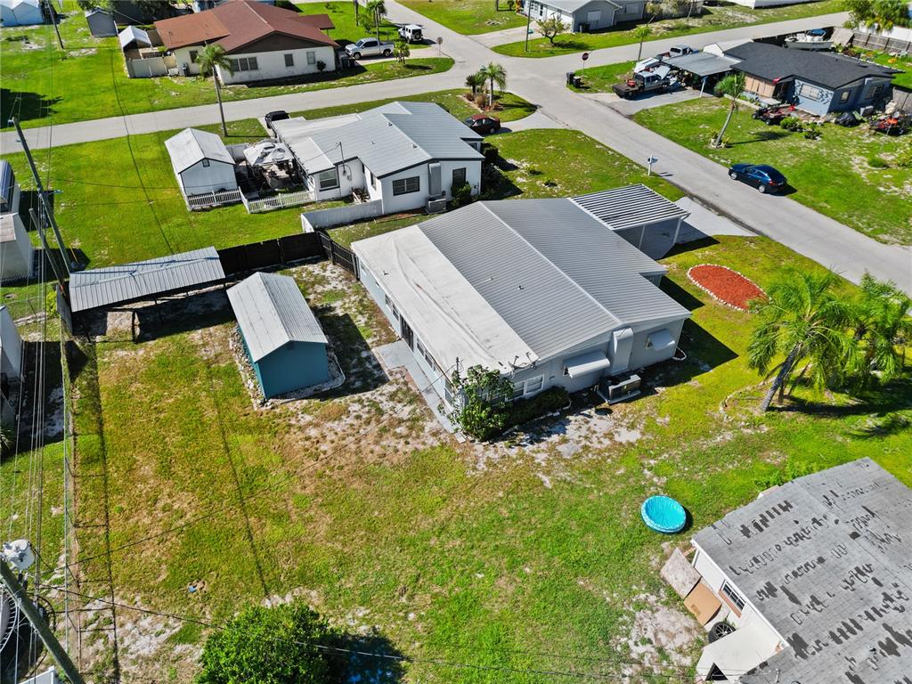 319 Thomas Avenue Frostproof, FL 33843 - Photo 36 of 47 an aerial view of a house with garden space and street view