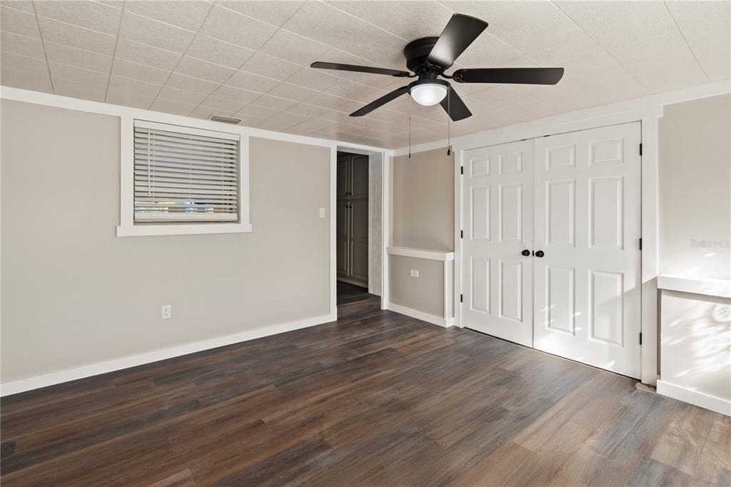 319 Thomas Avenue Frostproof, FL 33843 - Photo 4 of 47 a view of empty room with wooden floor and window