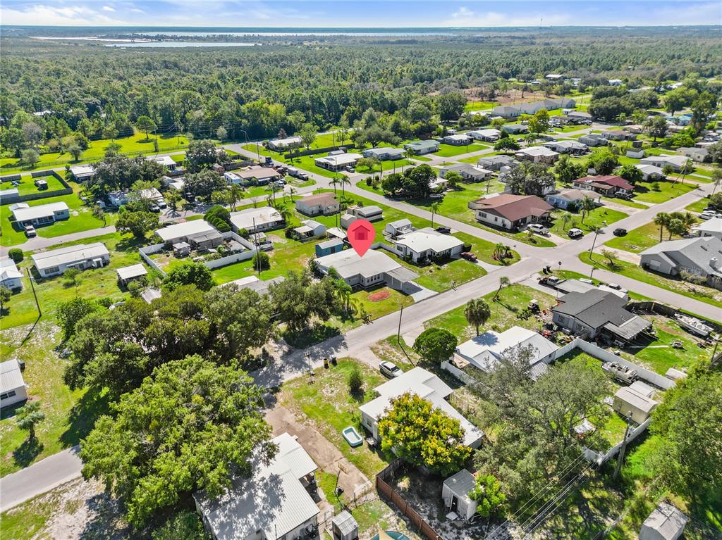 319 Thomas Avenue Frostproof, FL 33843 - Photo 47 of 47 an aerial view of residential houses with outdoor space and street view