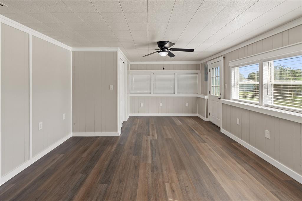 319 Thomas Avenue Frostproof, FL 33843 - Photo 5 of 47 a view of empty room with wooden floor and fan
