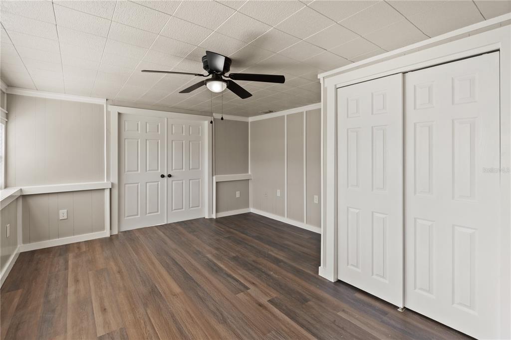 319 Thomas Avenue Frostproof, FL 33843 - Photo 6 of 47 a view of empty room with wooden floor and window