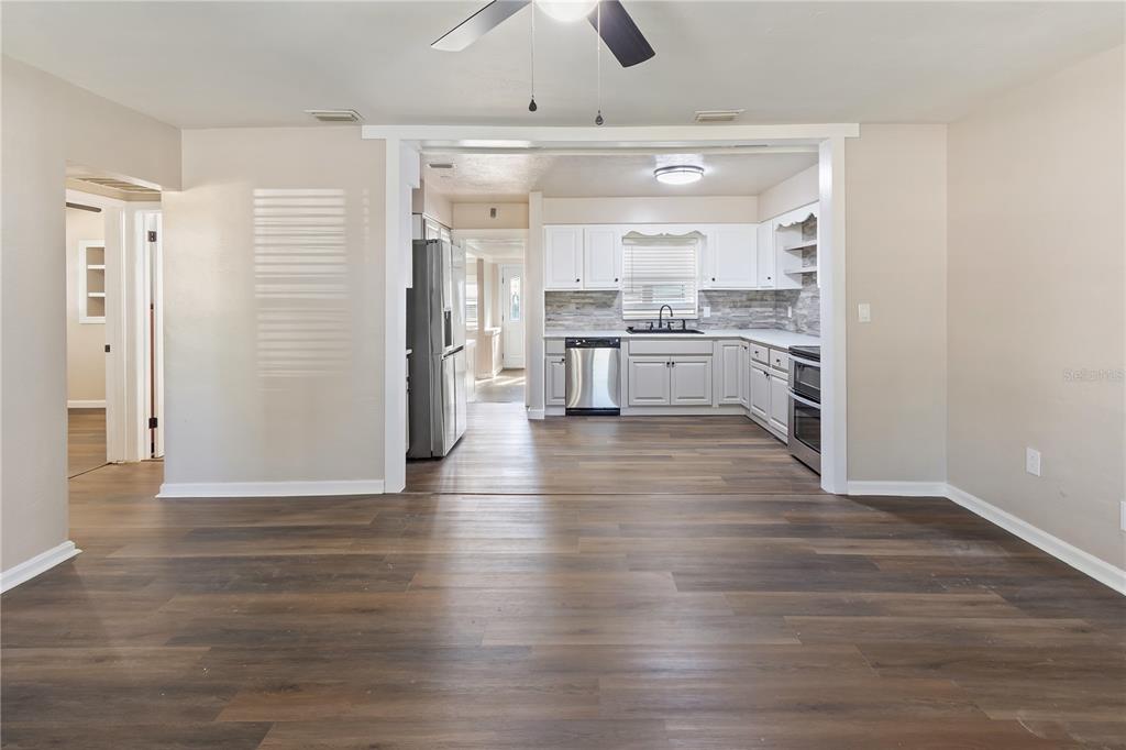 319 Thomas Avenue Frostproof, FL 33843 - Photo 9 of 47 a view of a kitchen cabinets and wooden floor