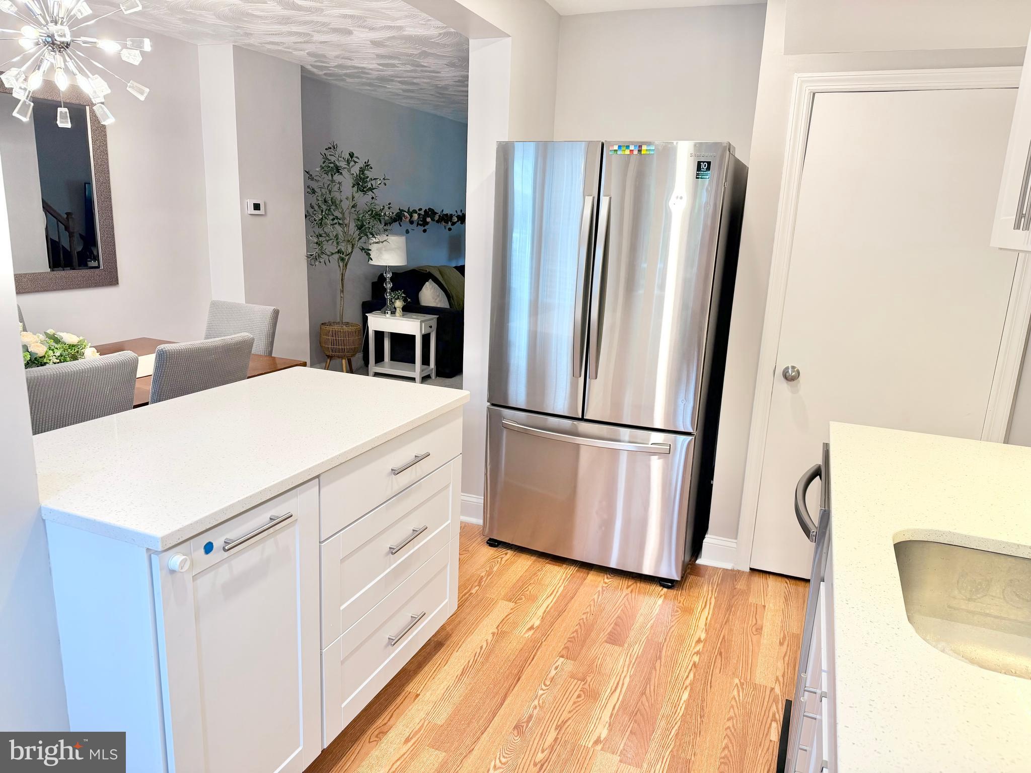 2235 Southorn Road Baltimore, MD 21220 - Photo 4 of 33 a kitchen with a refrigerator a sink and dishwasher