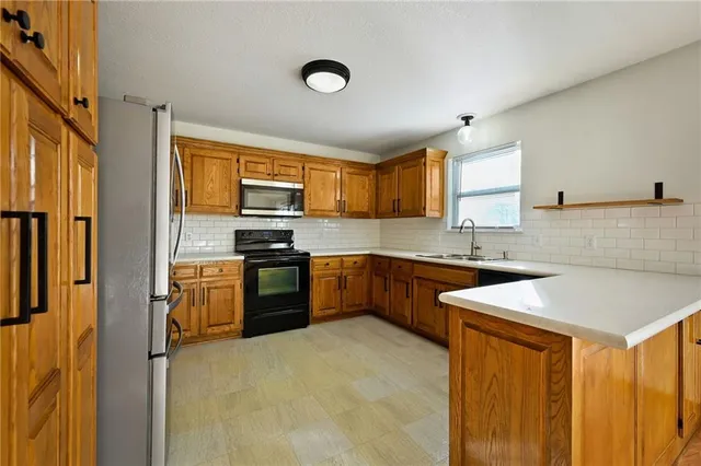 $320,000 | 109 East Heritage Drive, Raymore, MO 64083