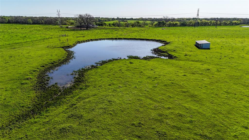 2007 Valley View Valley View, TX 76272 - Photo 6 of 10 Drone / aerial view of a nearby body of water and a tree filled landscape