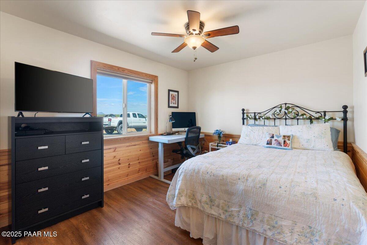0 Juniperwood Ranch Ash Fork, AZ 86320 - Photo 13 of 35 a bedroom with a bed and a flat tv screen on dresser