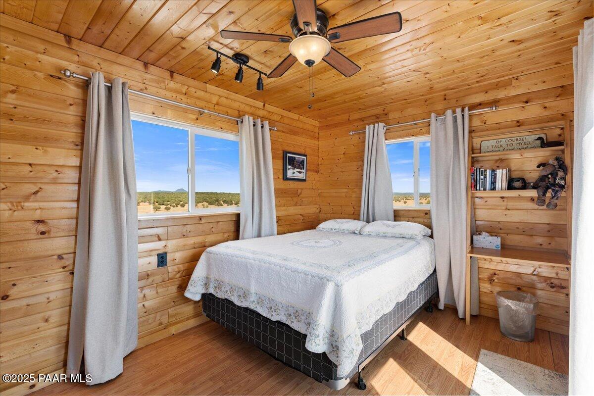 0 Juniperwood Ranch Ash Fork, AZ 86320 - Photo 26 of 35 a bedroom with a bed and a view of walk in closet