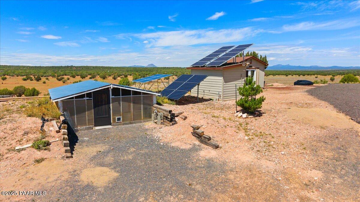 0 Juniperwood Ranch Ash Fork, AZ 86320 - Photo 30 of 35 a view of a house with a yard