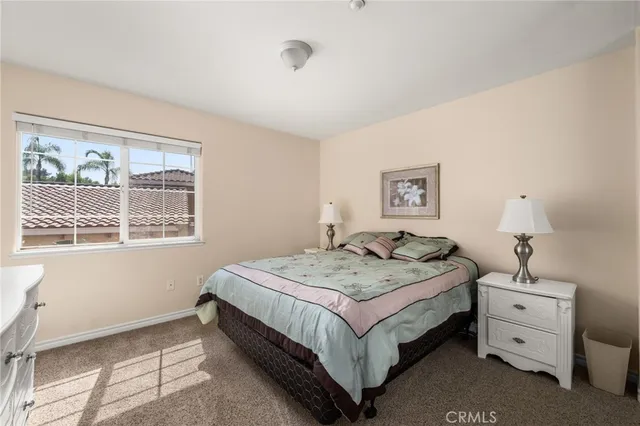 a bed room with a bed and a window