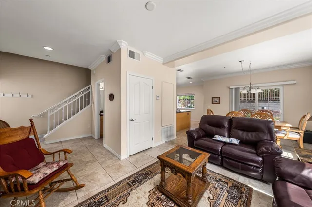 a living room with furniture and a rug