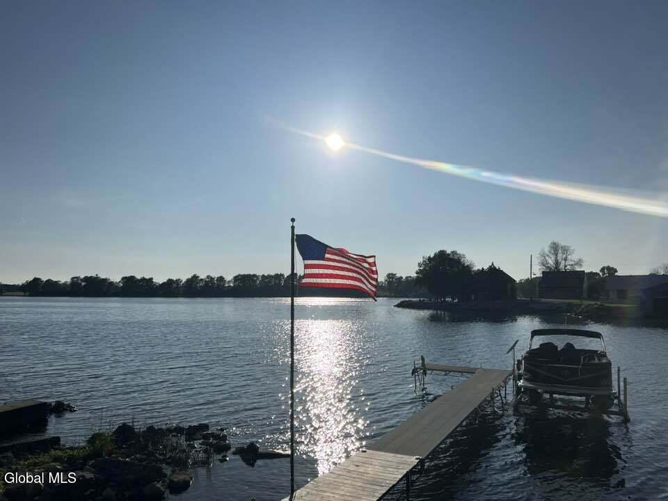 28363 Lotts Grove Road Lyme, NY 13622 - Photo 4 of 35 dock with flag