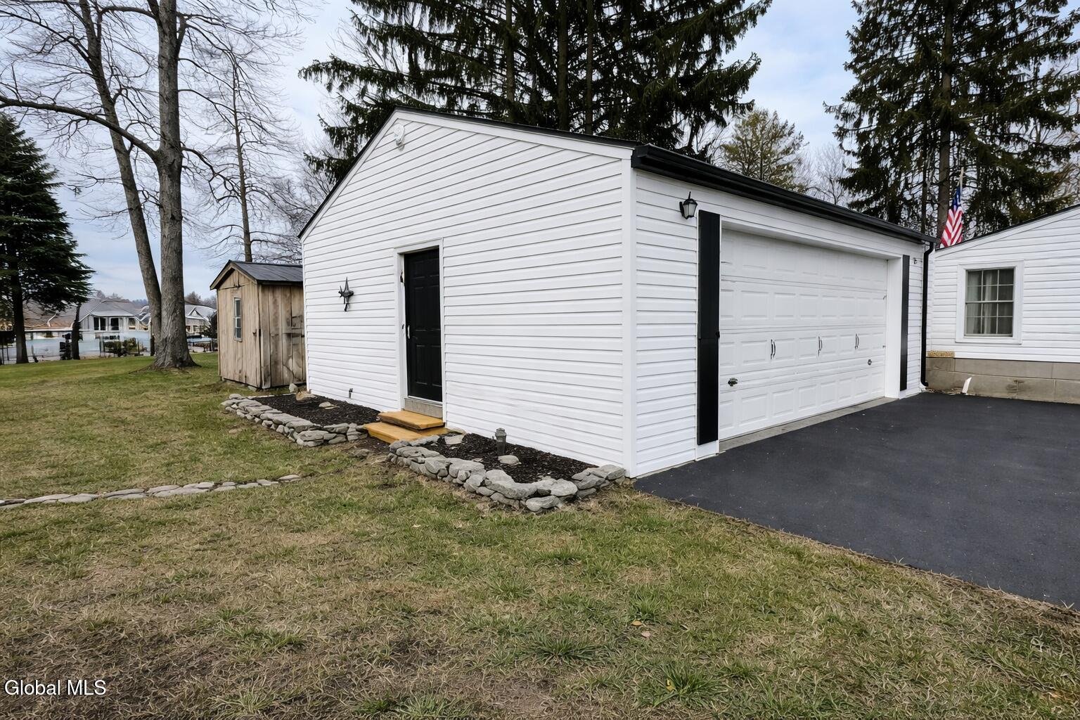 28363 Lotts Grove Road Lyme, NY 13622 - Photo 9 of 35 Detached garage in a backyard setting
