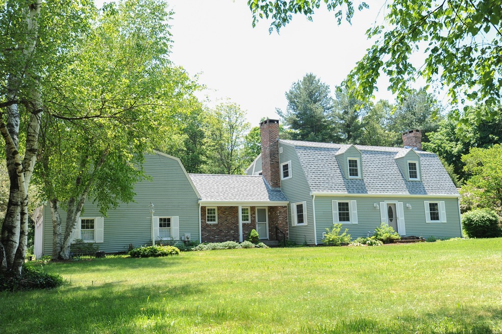 41 Chapel Road Amherst, MA 01002 - Photo 1 of 30 a front view of a house with a yard and trees