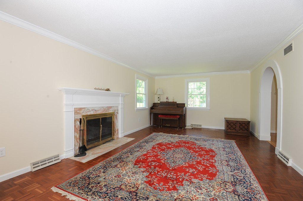 41 Chapel Road Amherst, MA 01002 - Photo 12 of 30 a living room with furniture and a fireplace