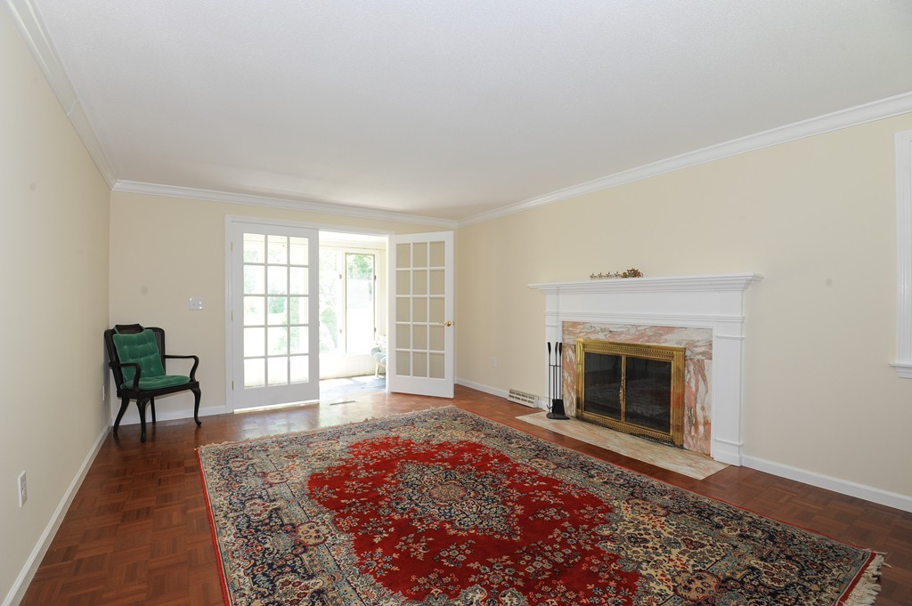 41 Chapel Road Amherst, MA 01002 - Photo 13 of 30 a living room with furniture and a fireplace
